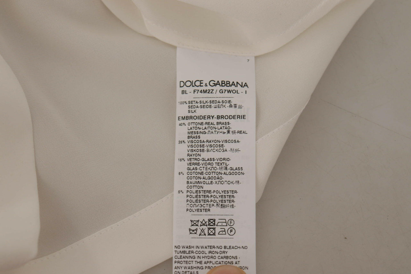 Dolce &amp; Gabbana Blusentop aus weißer Seide mit goldener DG-Krone und Kristallen