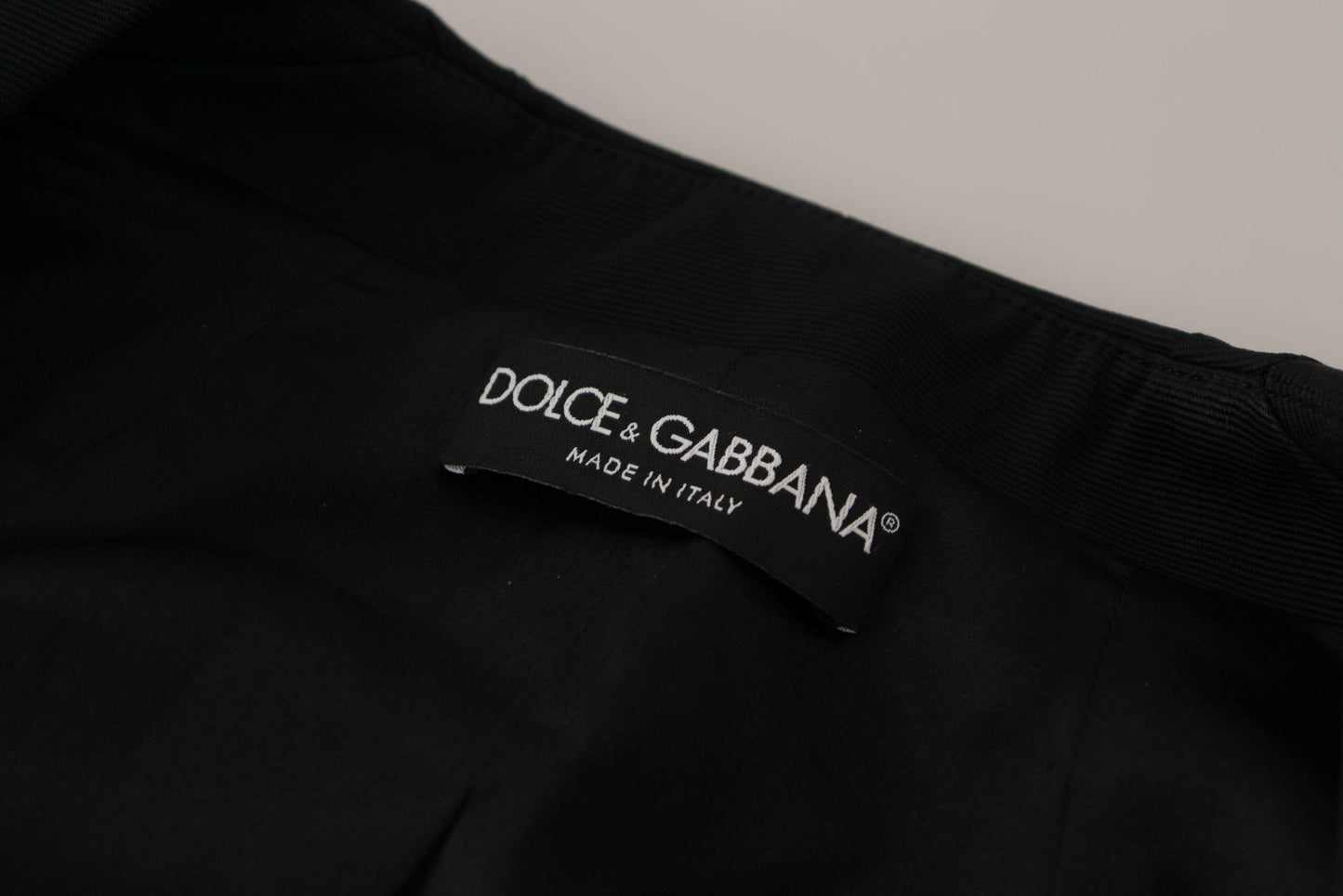 Dolce &amp; Gabbana - Veste noire élégante à boutons-pression avec doublure en soie