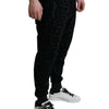 Dolce &amp; Gabbana – Schwarze Jogginghose aus Baumwolle mit Leopardenmuster und schmaler Passform
