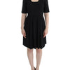 CO|TE Black short sleeve venus dress