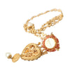 Collier Dolce &amp; Gabbana en laiton doré avec pendentif en cristal rose Sacré-Cœur