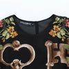 Dolce &amp; Gabbana Schwarze Seidenbluse mit Blumendruck