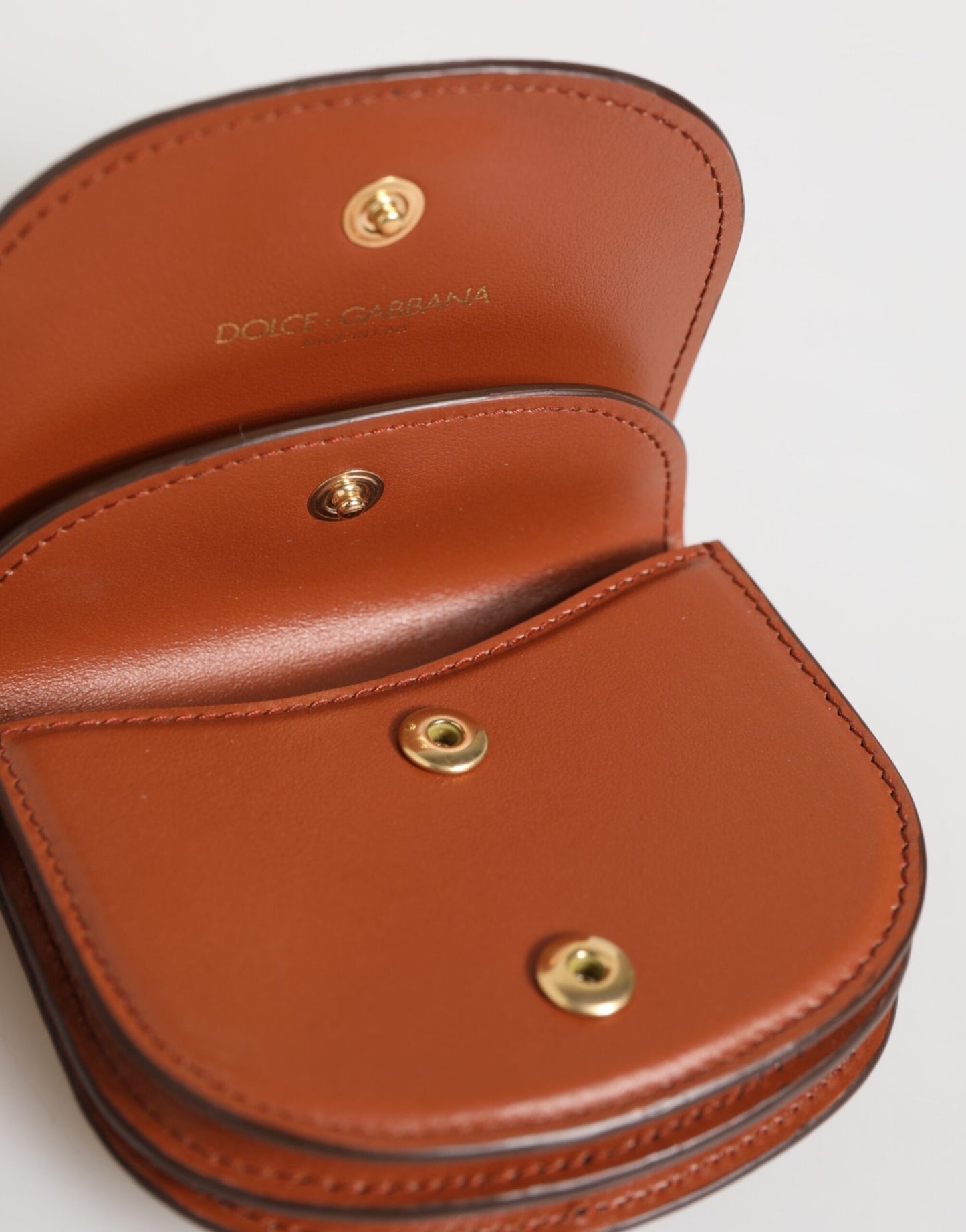 Dolce &amp; Gabbana Geldbörse aus braun-schwarzem Kalbsleder mit Leopardenmuster und Logo-Plakette