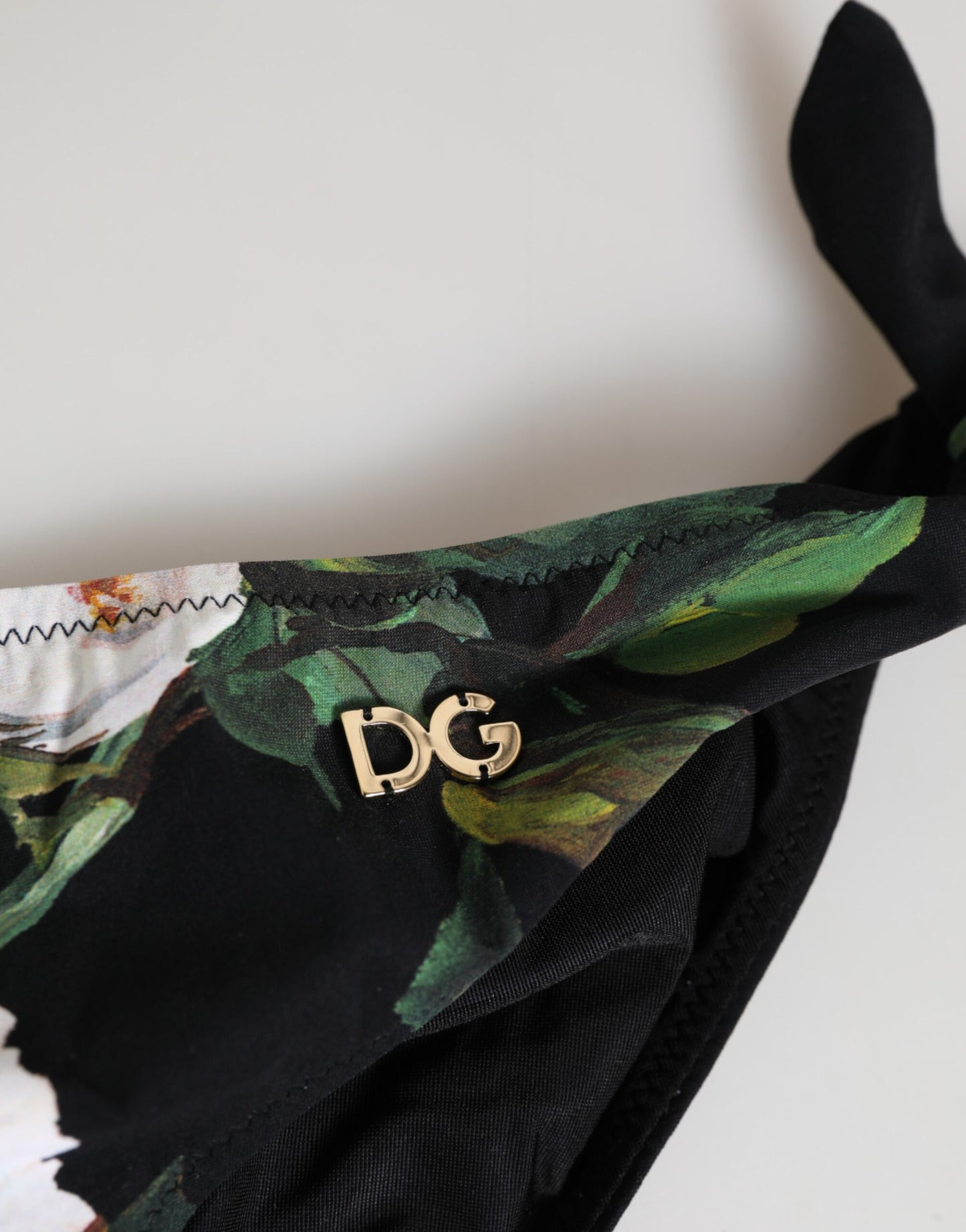 Dolce &amp; Gabbana Schwarze Bikinihose mit Blumenmuster und seitlichen Bindebändern