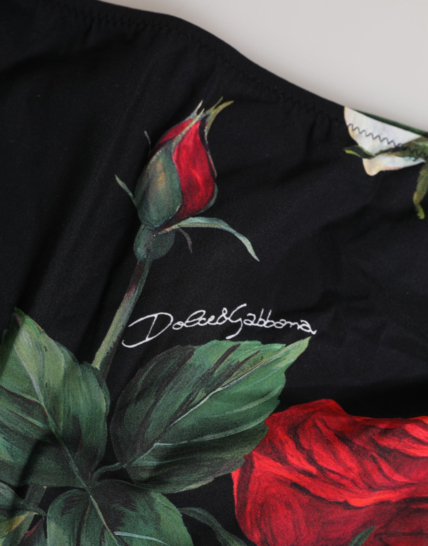 Dolce &amp; Gabbana Schwarze Bikinihose mit Blumenmuster und seitlichen Bindebändern