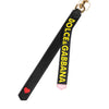 Dolce &amp; Gabbana Schlüsselanhänger mit schwarzem und gelbem Logo aus Leder und Messing